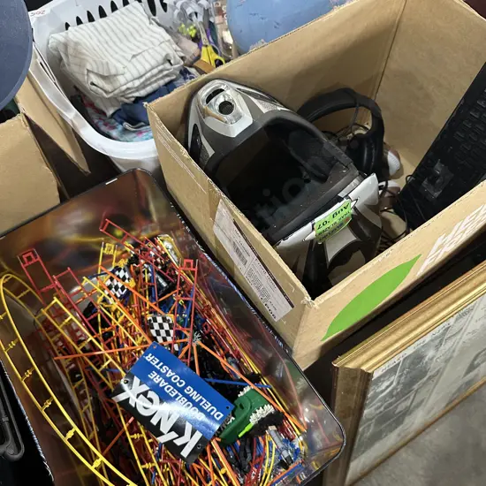 Box of headphones, keyboard, helmet and Knex.