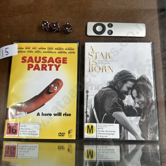 2 DVDs, apple TV remote & 3 dice...