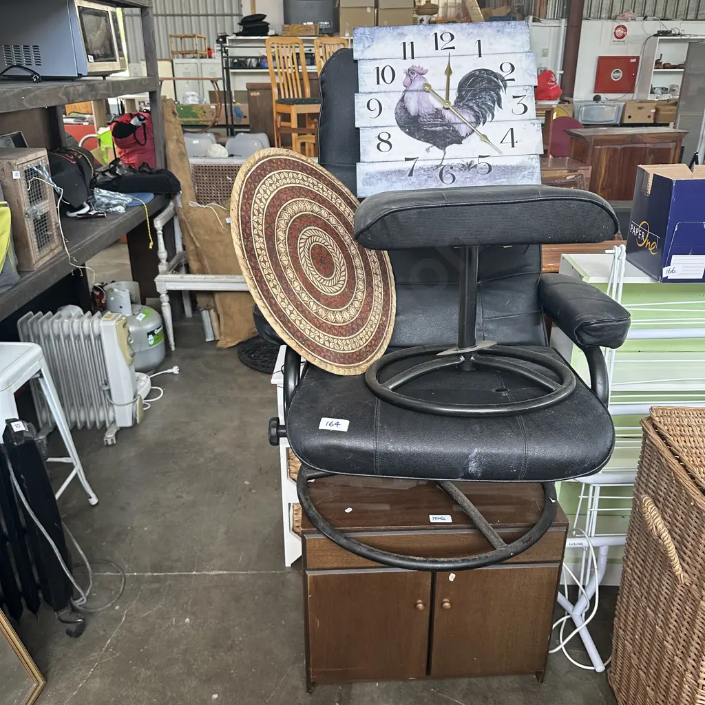 recliner chair and foot rest, tapa art, clock, cupboard Image 1++