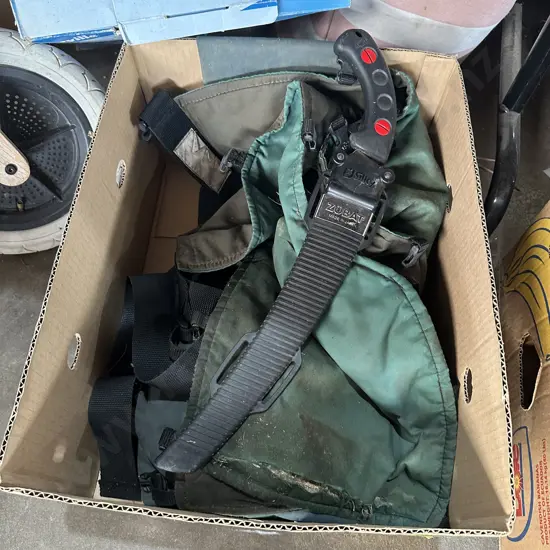 pruning saw and chaps