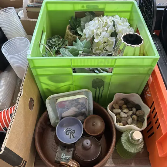 Bin of artificial plants, wooden bowl etc.