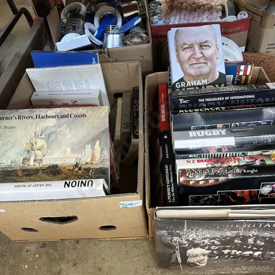 Two boxes of books including rugby books.