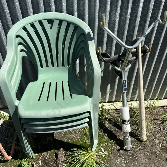 4 plastic chairs, bike rack and bat