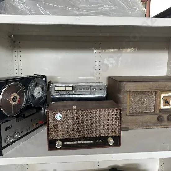Collection of antique radios and tape to tape player.