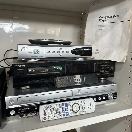 Sony CD player, Panasonic DVD/VCR combo player plus digital satellite receiver and remotes.