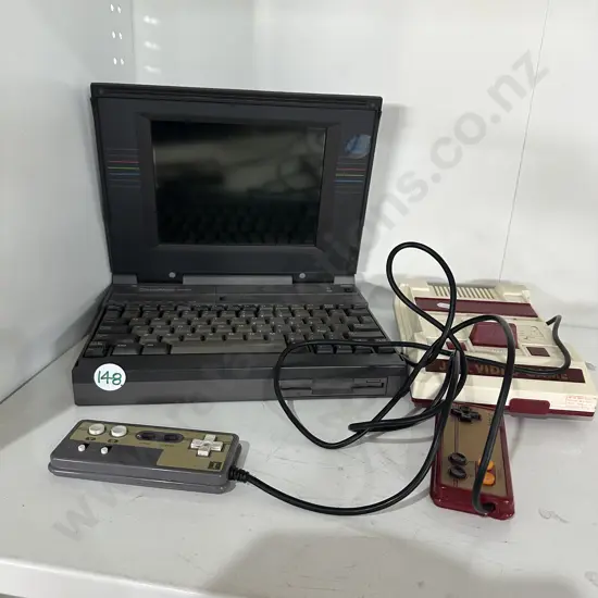 vintage laptop and JLB video game
