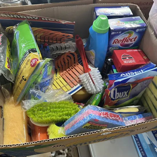 Box of new cleaning pads, brushes and laundry powder etc.