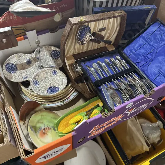 Box of china and cutlery sets etc.