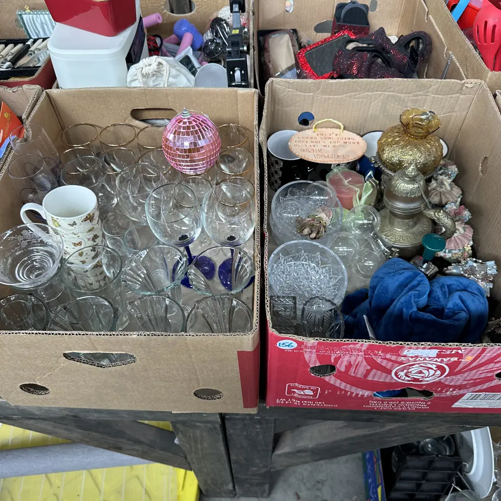 Two boxes including weighted neck wrap, glasses and ornaments etc. Image 1++