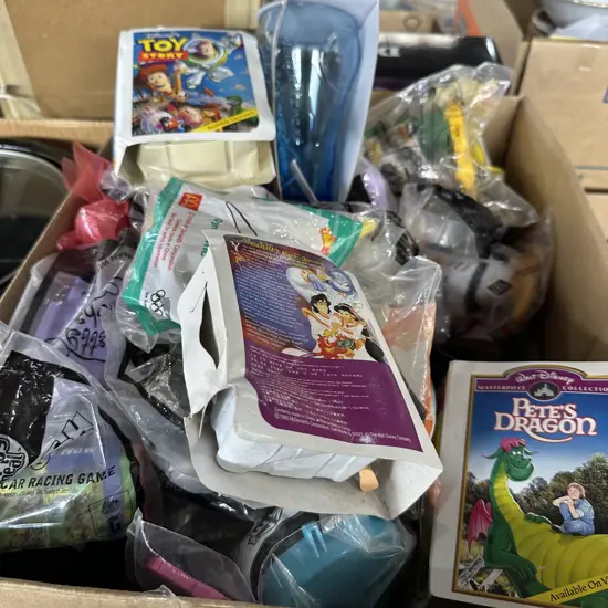 Box full of McDonalds toys and glasses in their original packets, plus some Disney.