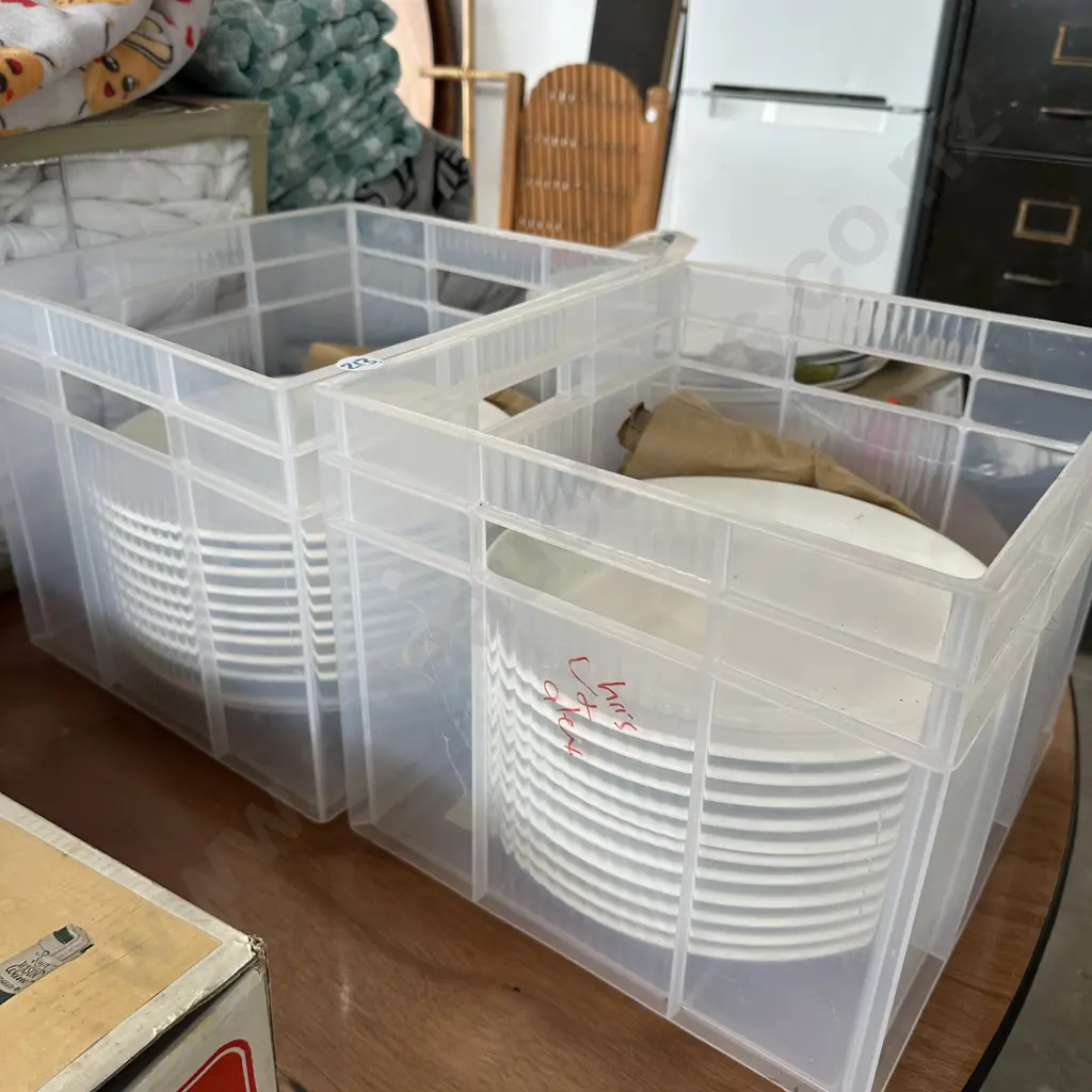 Two bins of white plates. Image 1++