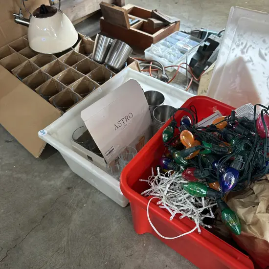 Bay lot of glasses, kettle, s/s cups, bin full of strings of lights.