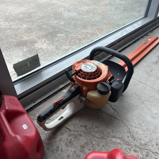 Stihl hedge trimmer and petrol can