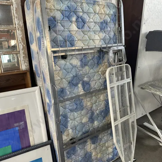 Average single bed plus trundle and ironing board frame.