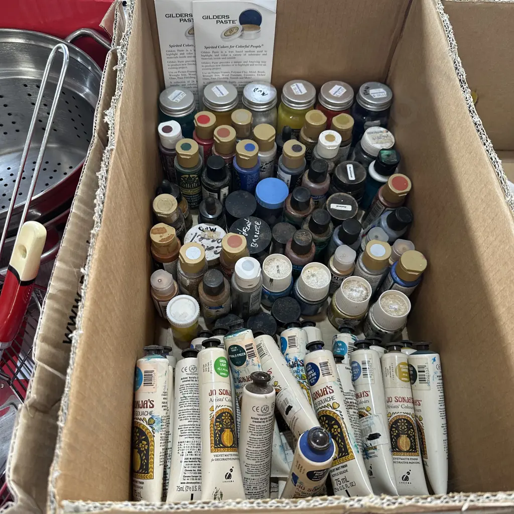 Box of assorted craft paints. Image 1++