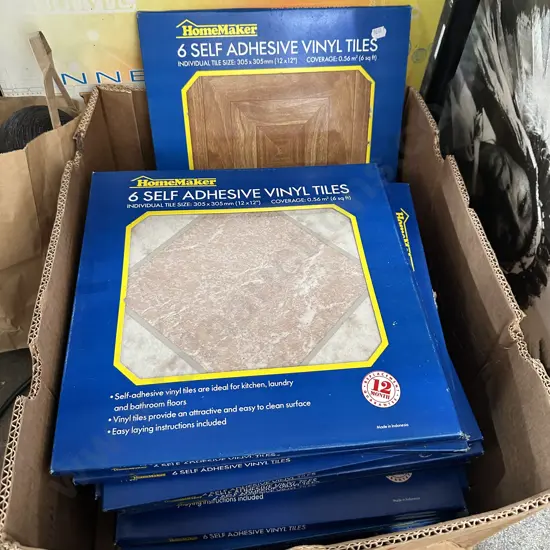 Box full of Self adhesive Vinyl tiles.