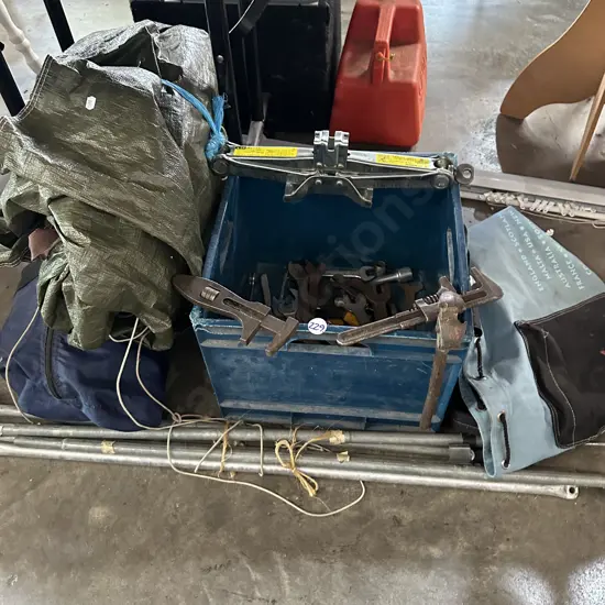 Bin of old tools, tent and shower tent,