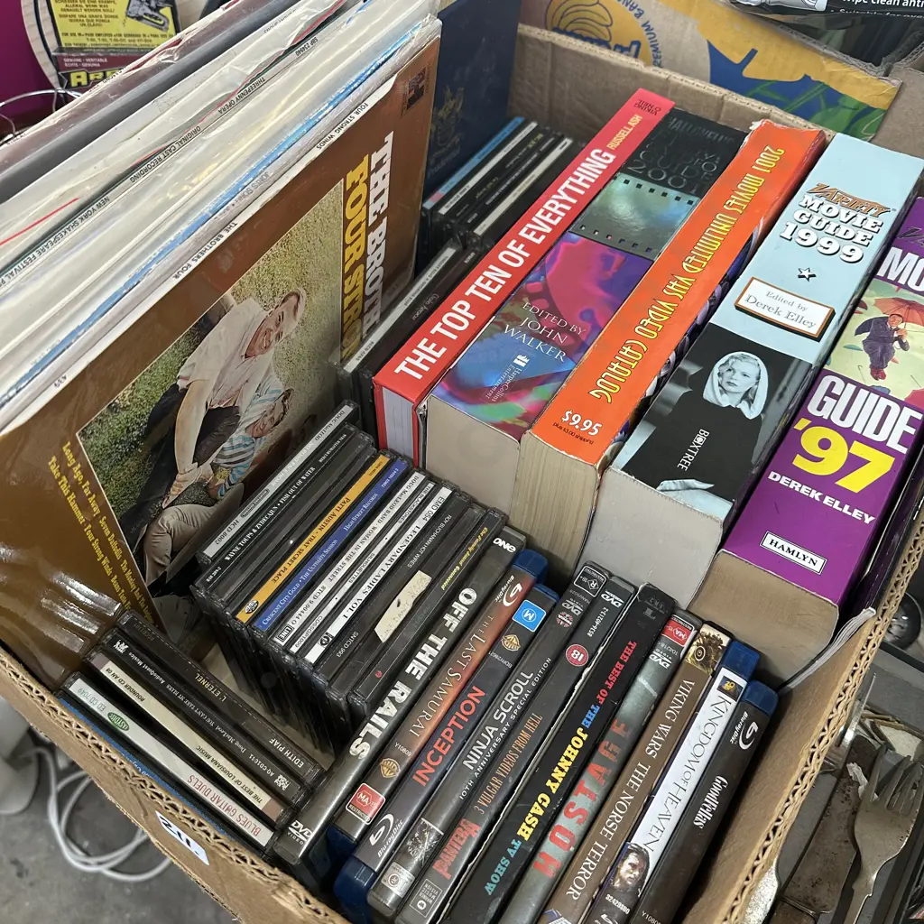Box of movie books, LPs, CDs and DVDs. Image 1++