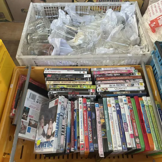 Vege bin of DVD movies plus bin of glassware etc.